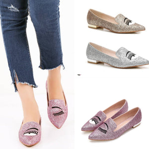 "163" Glitter covered slip on flats with eye detail